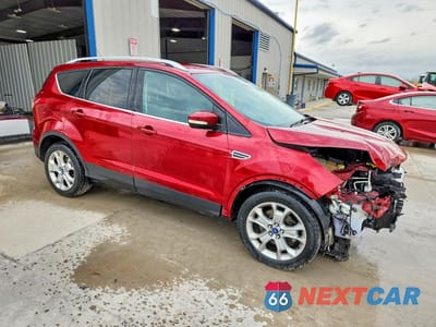 Czwarte zdjęcie samochodu z boku: 2015 FORD ESCAPE TITANIUM VIN:1FMCU0J97FUB94120 - miniatura