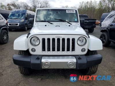 Piąte zdjęcie samochodu w środku: 2017 JEEP WRANGLER UNLIMITED SAHARA VIN:1C4BJWEG3HL582040 - miniatura