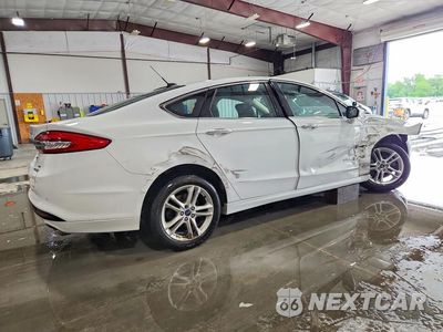 Trzecie zdjęcie samochodu z tyłu: 2018 FORD FUSION SE HYBRID VIN:3FA6P0LU0JR171956 - miniatura