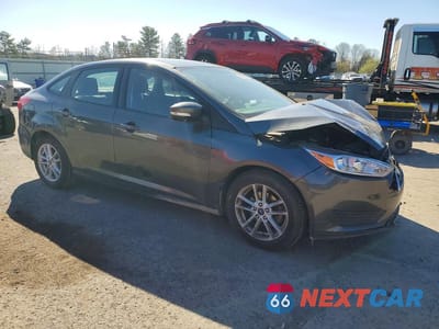 Czwarte zdjęcie samochodu z boku: 2018 FORD FOCUS SE VIN:1FADP3F21JL318576 - miniatura