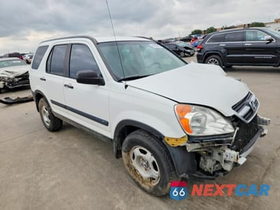 Czwarte zdjęcie samochodu z boku: 2002 HONDA CR-V LX VIN:JHLRD68452C000280 - miniatura