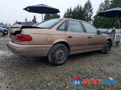Trzecie zdjęcie samochodu z tyłu: 1992 FORD TAURUS GL VIN:1FACP52U8NG231691 - miniatura