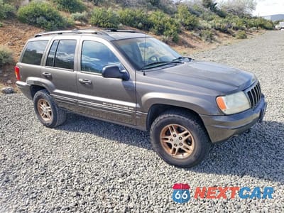 Czwarte zdjęcie samochodu z boku: 1999 JEEP GRAND CHEROKEE LIMITED VIN:1J4GW68N2XC677361 - miniatura
