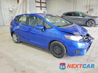 Czwarte zdjęcie samochodu z boku: 2016 HONDA FIT LX VIN:JHMGK5H5XGX032640 - miniatura