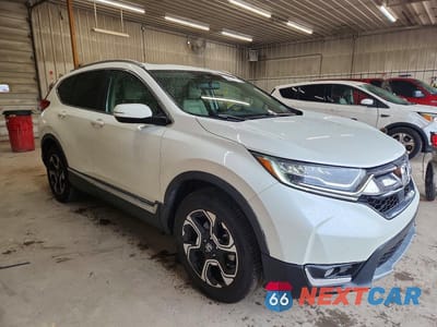 Czwarte zdjęcie samochodu z boku: 2017 HONDA CR-V TOURING VIN:2HKRW2H91HH650118 - miniatura