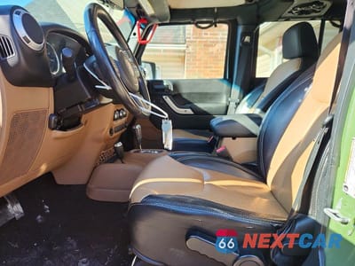 Zdjęcie 7 z 12 samochodu: 2014 JEEP WRANGLER UNLIMITED SAHARA VIN:1C4HJWEG8EL117971 - miniatura