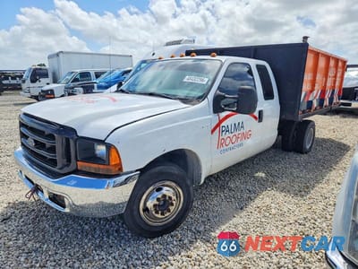 Drugie zdjęcie samochodu z przodu: 1999 FORD F350 SUPER DUTY DUMP TRUCK VIN:1FDWX36S1XED73380 - miniatura