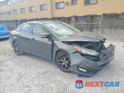 Czwarte zdjęcie samochodu z boku: 2018 FORD FOCUS SEL VIN:1FADP3H29JL265882 - miniatura