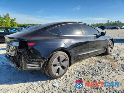 Trzecie zdjęcie samochodu z tyłu: 2023 TESLA MODEL 3 VIN:5YJ3E1EA2PF385501 - miniatura