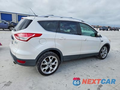 Trzecie zdjęcie samochodu z tyłu: 2016 FORD ESCAPE TITANIUM VIN:1FMCU0J93GUC78341 - miniatura