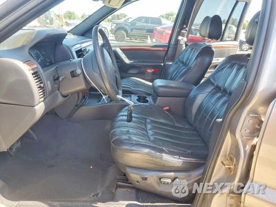 Zdjęcie 7 z 13 samochodu: 1999 JEEP GRAND CHEROKEE LIMITED VIN:1J4GW68N8XC670513 - miniatura