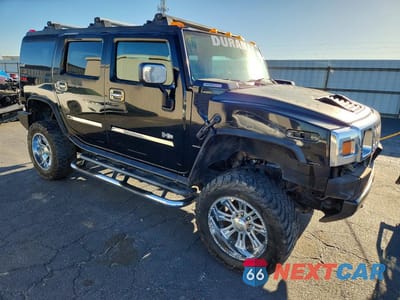 Czwarte zdjęcie samochodu z boku: 2003 HUMMER H2 VIN:5GRGN23U13H107489 - miniatura