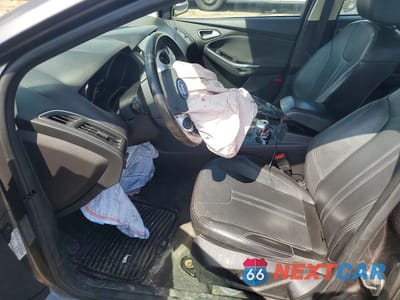 Zdjęcie 7 z 11 samochodu: 2014 FORD FOCUS TITANIUM VIN:1FADP3J21EL116950 - miniatura