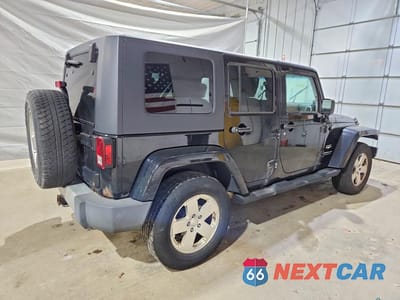 Trzecie zdjęcie samochodu z tyłu: 2010 JEEP WRANGLER UNLIMITED SAHARA VIN:1J4BA5H17AL116967 - miniatura