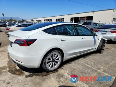 Trzecie zdjęcie samochodu z tyłu: 2023 TESLA MODEL 3 VIN:5YJ3E1EA2PF450377 - miniatura