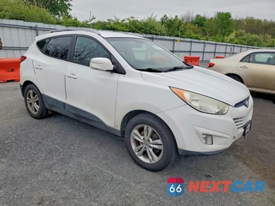 Czwarte zdjęcie samochodu z boku: 2013 HYUNDAI TUCSON GLS VIN:KM8JU3AC6DU761032 - miniatura