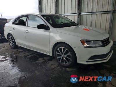 Czwarte zdjęcie samochodu z boku: 2016 VOLKSWAGEN JETTA SE VIN:3VWD67AJ6GM360202 - miniatura