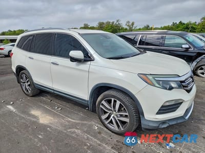 Czwarte zdjęcie samochodu z boku: 2017 HONDA PILOT TOURING VIN:5FNYF5H97HB036542 - miniatura