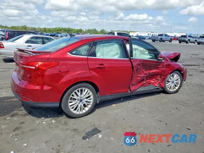 Trzecie zdjęcie samochodu z tyłu: 2017 FORD FOCUS TITANIUM VIN:1FADP3J29HL322974 - miniatura