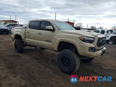 Czwarte zdjęcie samochodu z boku: 2016 TOYOTA TACOMA SR V6 VIN:3TMCZ5AN0GM040144 - miniatura