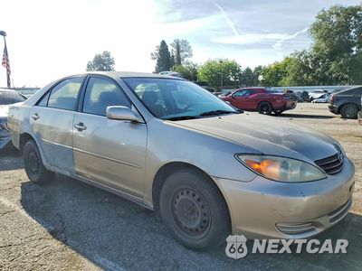 Czwarte zdjęcie samochodu z boku: 2002 TOYOTA CAMRY LE VIN:JTDBE32K520051099 - miniatura
