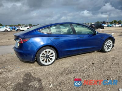 Trzecie zdjęcie samochodu z tyłu: 2022 TESLA MODEL 3 VIN:5YJ3E1EA9NF372659 - miniatura