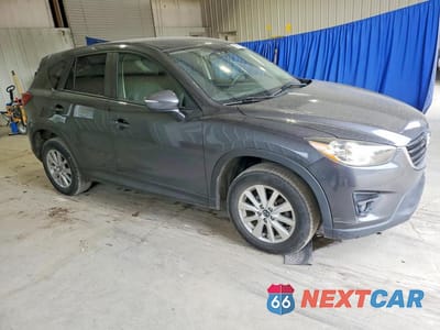 Czwarte zdjęcie samochodu z boku: 2016 MAZDA CX-5 TOURING VIN:JM3KE4CY4G0625814 - miniatura