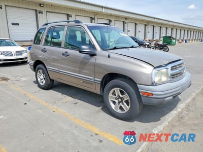 Czwarte zdjęcie samochodu z boku: 2003 CHEV TRACKER VIN:2CNBJ13CX36920520 - miniatura