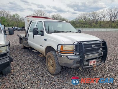 Czwarte zdjęcie samochodu z boku: 1999 FORD F350 SUPER DUTY FLATBED TRUCK VIN:1FTSW31F1XEE65931 - miniatura