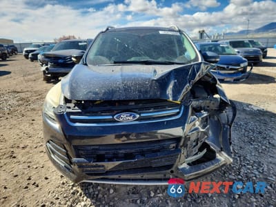 Piąte zdjęcie samochodu w środku: 2015 FORD ESCAPE TITANIUM VIN:1FMCU0J97FUB25248 - miniatura