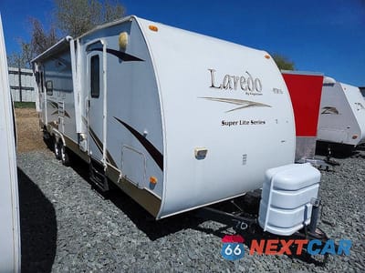 2009 KEYSTONE LAREDO CAMPER 4YDT272209L600704 - główne zdjęcie licytacji z USA - miniatura