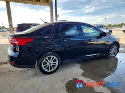 Trzecie zdjęcie samochodu z tyłu: 2018 FORD FOCUS SE VIN:1FADP3FEXJL247131 - miniatura