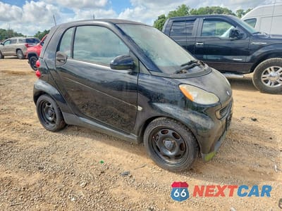 Czwarte zdjęcie samochodu z boku: 2012 SMART FORTWO PURE VIN:WMEEJ3BAXCK572181 - miniatura