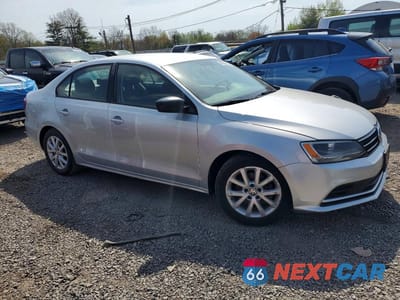 Czwarte zdjęcie samochodu z boku: 2016 VOLKSWAGEN JETTA SE VIN:3VWD67AJ3GM253639 - miniatura