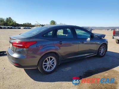Trzecie zdjęcie samochodu z tyłu: 2018 FORD FOCUS SE VIN:1FADP3F21JL318576 - miniatura