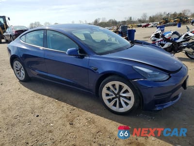 Czwarte zdjęcie samochodu z boku: 2022 TESLA MODEL 3 VIN:5YJ3E1EB2NF278728 - miniatura