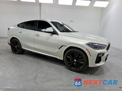 Czwarte zdjęcie samochodu z boku: 2021 BMW X6 M50I VIN:5UXCY8C04M9E21187 - miniatura