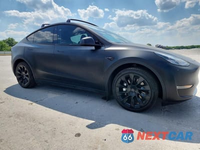 Czwarte zdjęcie samochodu z boku: 2023 TESLA MODEL Y VIN:7SAYGDEE9PA090710 - miniatura
