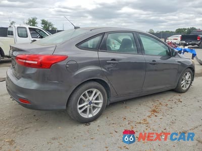 Trzecie zdjęcie samochodu z tyłu: 2018 FORD FOCUS SE VIN:1FADP3F25JL245454 - miniatura