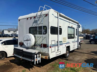Czwarte zdjęcie samochodu z boku: 1999 FORD E-350 RVS RV VIN:1FDWE30S0XHC04383 - miniatura
