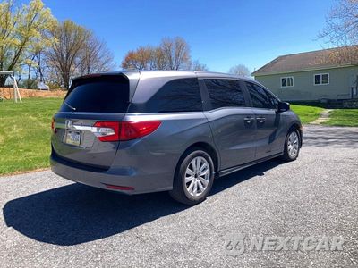 Czwarte zdjęcie samochodu z boku: 2018 HONDA ODYSSEY LX VIN:5FNRL6H20JB053064 - miniatura