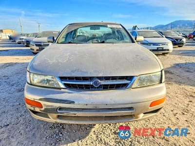 Piąte zdjęcie samochodu w środku: 1999 NISSAN MAXIMA SE LIMITED VIN:JN1CA21AXXT104682 - miniatura