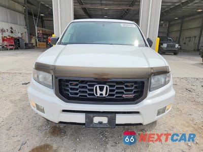 Piąte zdjęcie samochodu w środku: 2014 HONDA RIDGELINE SPORT VIN:5FPYK1F78EB010217 - miniatura