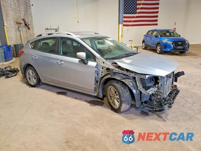 Czwarte zdjęcie samochodu z boku: 2017 SUBARU IMPREZA PREMIUM PLUS VIN:4S3GTAD63H3706044 - miniatura