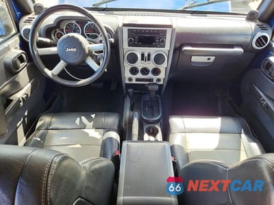 Zdjęcie 8 z 12 samochodu: 2009 JEEP WRANGLER UNLIMITED SAHARA VIN:1J8GA59199L715254 - miniatura