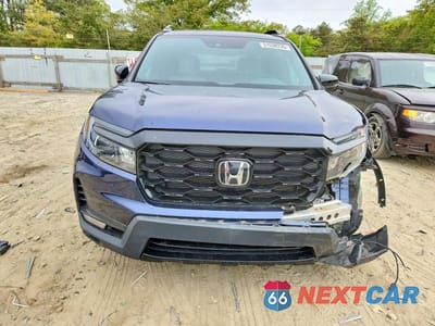 Piąte zdjęcie samochodu w środku: 2022 HONDA PASSPORT ELITE VIN:5FNYF8H01NB032033 - miniatura
