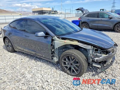 Czwarte zdjęcie samochodu z boku: 2023 TESLA MODEL 3 VIN:5YJ3E1EAXPF713411 - miniatura