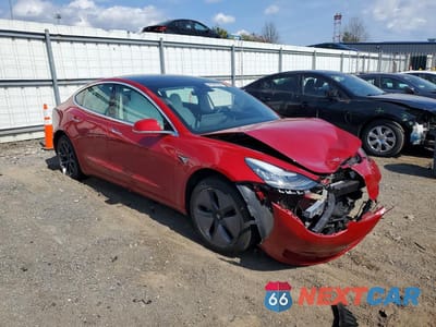 Czwarte zdjęcie samochodu z boku: 2019 TESLA MODEL 3 VIN:5YJ3E1EA3KF312288 - miniatura