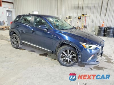 Czwarte zdjęcie samochodu z boku: 2017 MAZDA CX-3 GRAND TOURING VIN:JM1DKFD74H0160335 - miniatura
