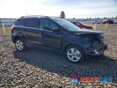 Czwarte zdjęcie samochodu z boku: 2016 FORD ESCAPE SE VIN:1FMCU9G99GUC00433 - miniatura